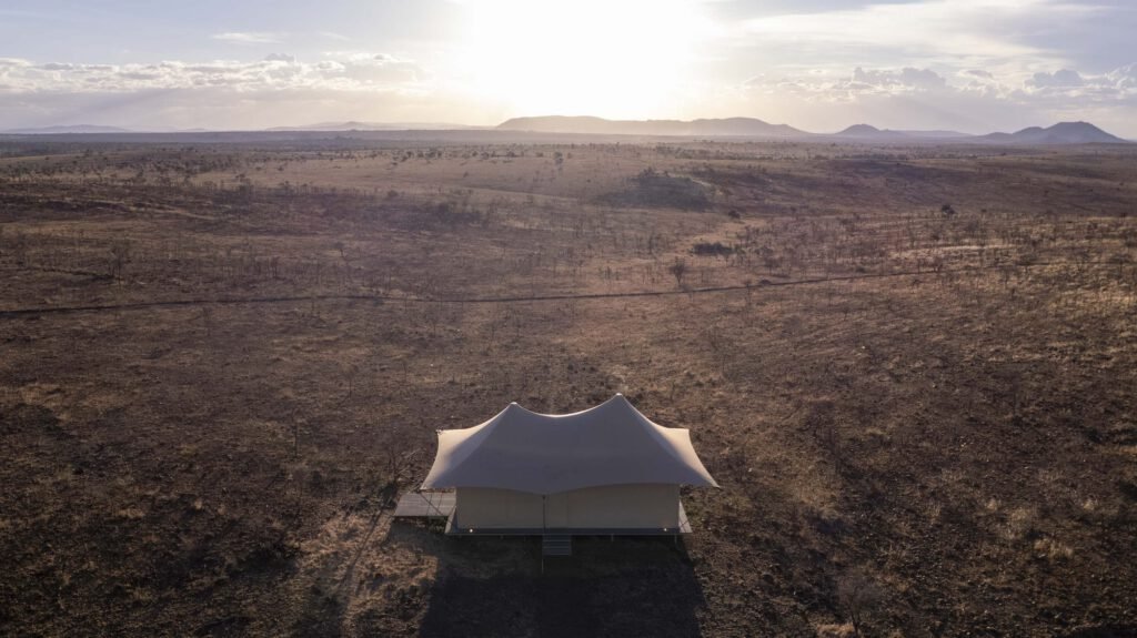 A tent at Escape Luxury Lodge at sunrise
