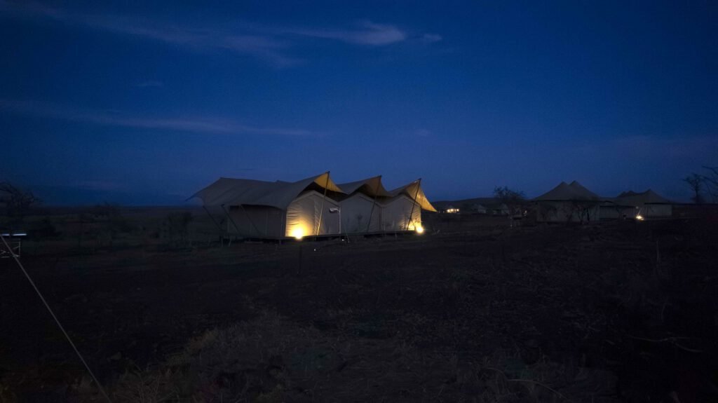 Escape Luxury Lodge tents lit at night